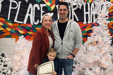 Family photo in front of decorations