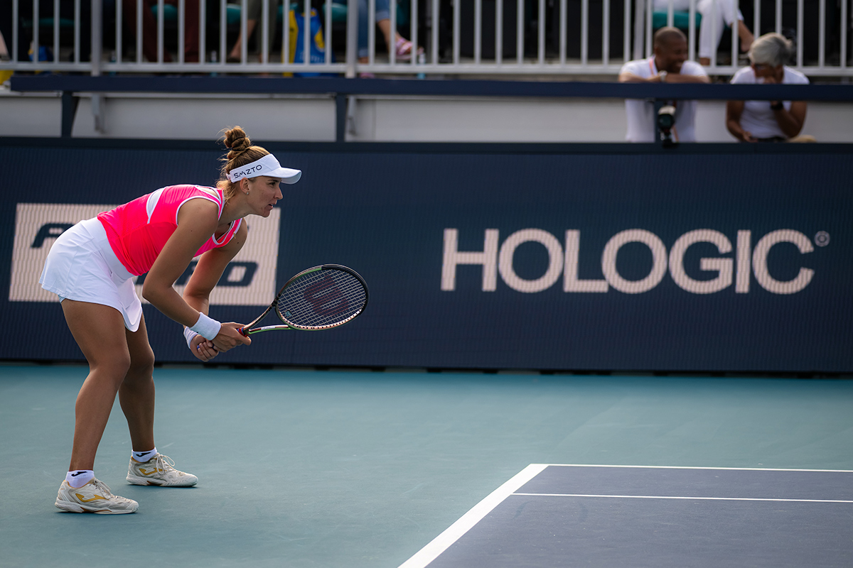 Female tennis player ready to play on tennis court