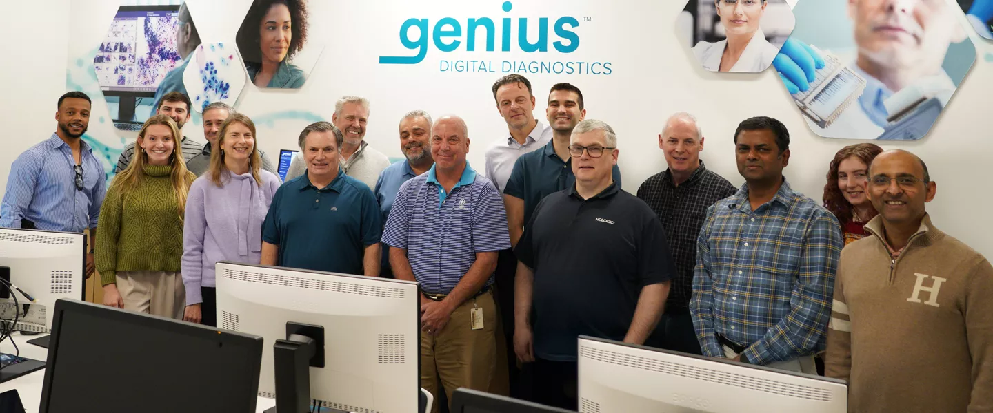 Team members standing together in lab setting.