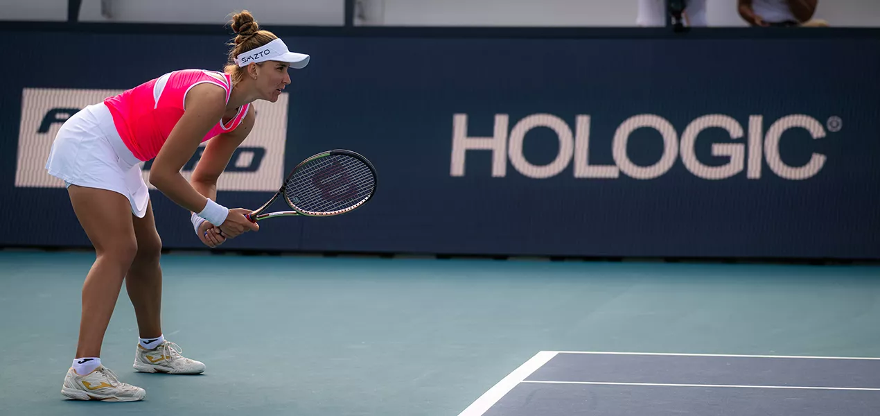 Female tennis player ready to play on tennis court