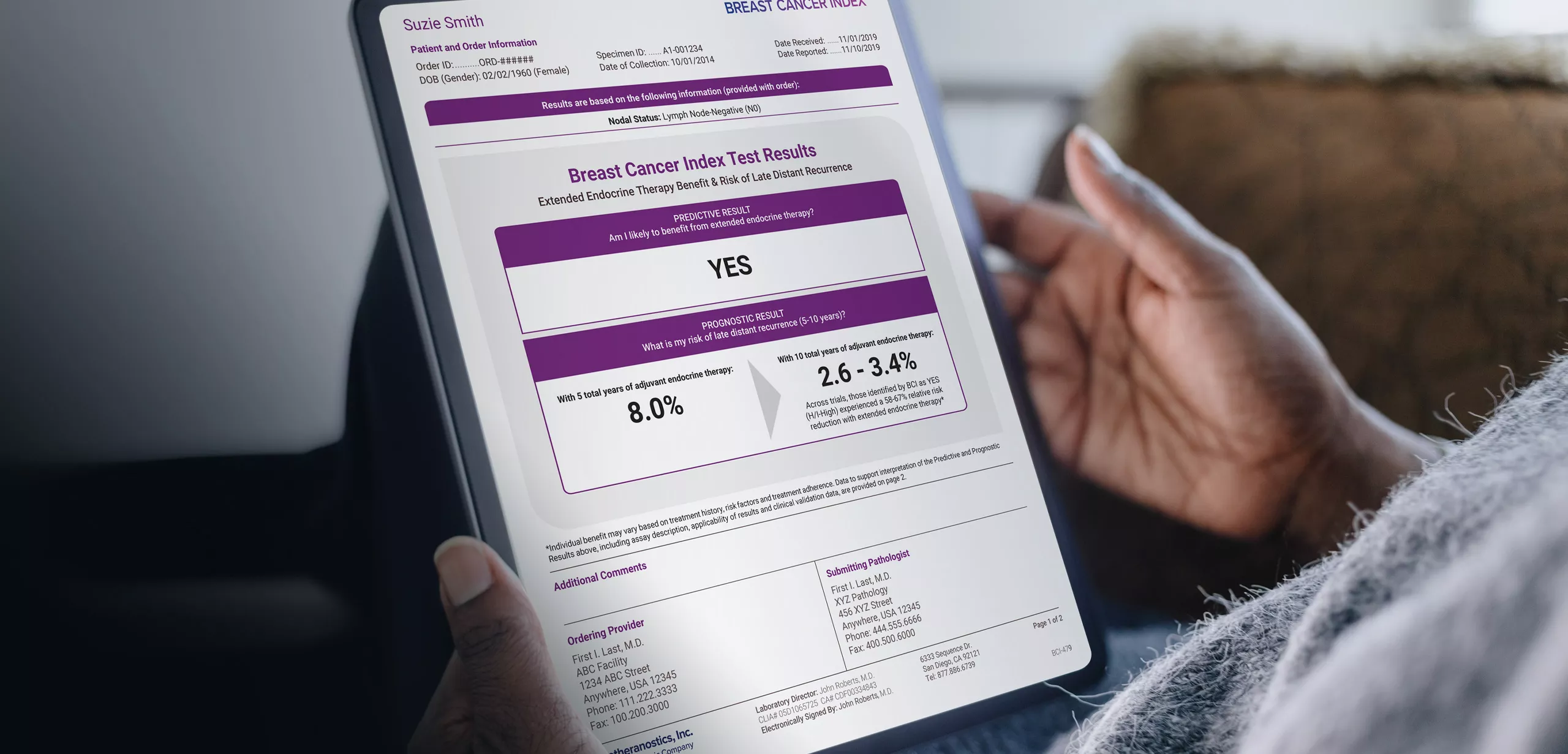 Person holding tablet showing report information