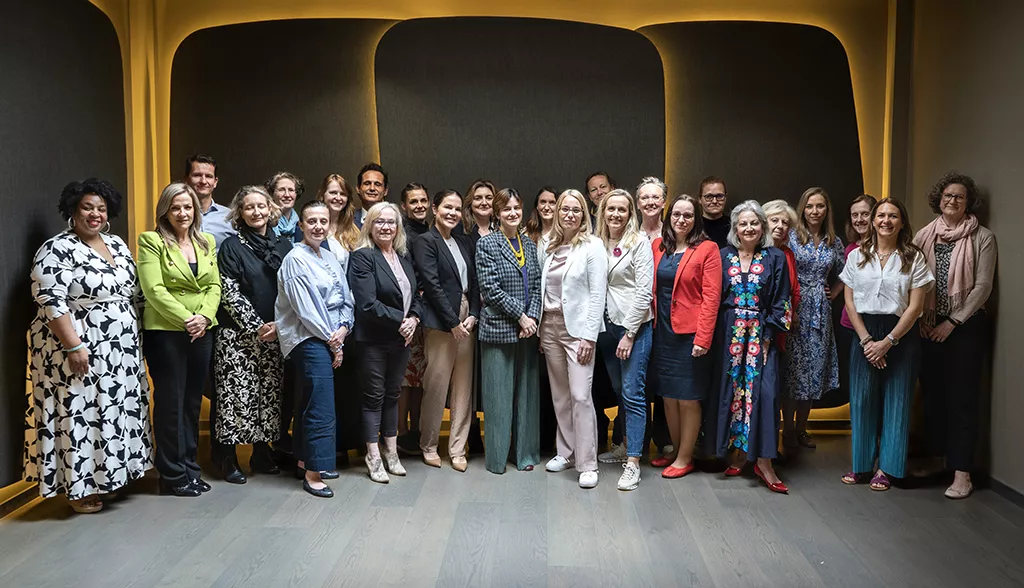 Group photo of health experts inside conference room.