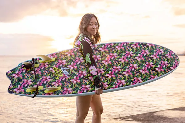 Woman holding surfboard